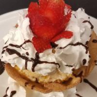 Deep Fried Ice Cream · Vanilla ice cream, fried tortilla topped with chocolate sauce and whip cream.