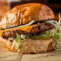 Beyond Burger · Single beyond burger patty, vegan American cheese, iceberg lettuce, raw onion, sliced dill p...
