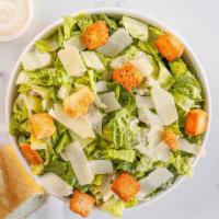 Classic Caesar Salad · Romaine lettuce, parmesan garlic croutons, shaved parmesan, and Caesar dressing.
