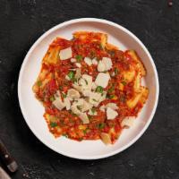 Meet The Meat Ravioli · Juicy meat ravioli pasta cooked in our house made marinara sauce topped with fresh basil top...