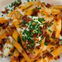 The Ultimate Bae-Con Cheese Fries · Idaho potato fries cooked until golden brown and garnished with salt, melted cheddar cheese,...