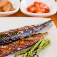 Go Dung U Gui · Lightly salted and grilled mackerel fish.