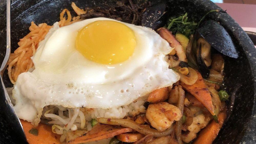 Bi Bim Bob · Vegetarian. Spicy. Steamed white rice mixed with red pepper sauce, an assortment of seasoned vegetables, beef and fried egg. Includes egg.