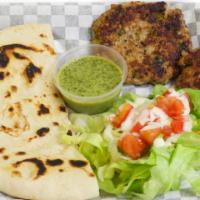 Chapli Kabob · A patty made of ground chicken, onions, tomatoes, green chilies, and other spices. Served wi...