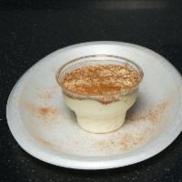 Rice Pudding · Homemade rice pudding with sprinkled cinnamon.