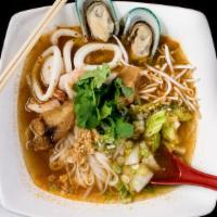 Tom Yum Seafood Noodle Soup · Spicy Tom Yum noodle soup w/ seafood and vegetables.