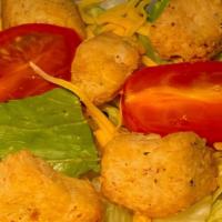 Side Salad · Romaine mix with cheddar cheese, sliced tomatoes and croutons.