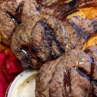 4 Lamb Chops Bowl'S · 4 lamb chops marinated to perfection on a bed of yellow rice or french fries + fresh green s...