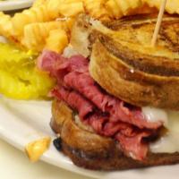 The Rueben · Lean corned beef piled on grilled rye bread with swiss, sauerkraut and russian dressing.