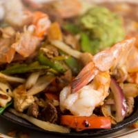 Veggie Fajitas · A sizzling mix of carrots, bell peppers, tomatoes, onions and mushrooms served with rice, le...
