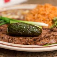 Carne Asada · Skirt steak served with rice, beans and French fries.