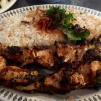 Shish Tawook · Charbroiled marinated chicken cubes, served with garlic sauce