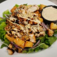 Caesar Salad · Crisp romaine lettuce with croutons, parmesan cheese, and red onion with creamy Caesar dress...