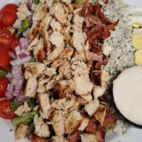 Chopped Chicken Cobb Salad · Assorted fresh greens and vegetables, topped with chicken, green pepper, tomato, bacon, blue...