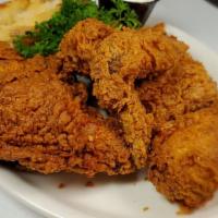 Fried Chicken Dinner · Half chicken breaded and deep fried until golden brown.
