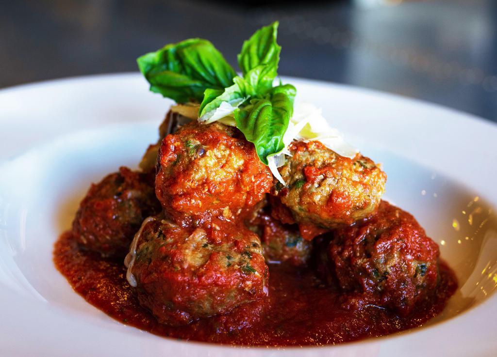 Andre'S Mini Meatballs · A new version of an old favorite. Pork and beef meatballs in house marinara with fresh herbs and shaved parmesan.