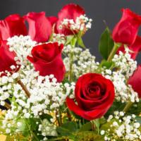Classic Dozen Red Roses · Show your love, passion, and gratitude with red roses. Accented with filler flowers, an arra...