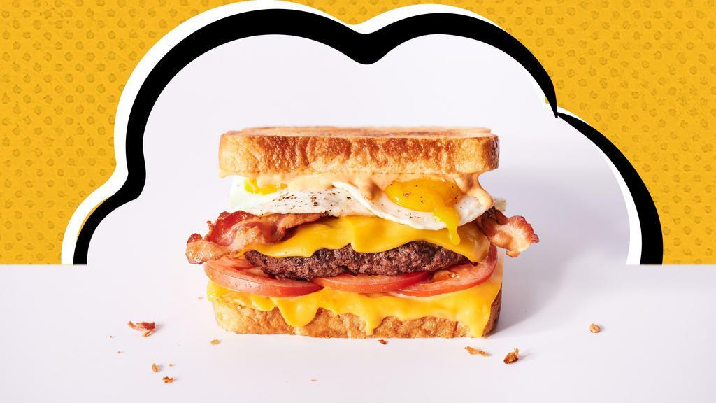 Rise ‘N Shine Melt · Hamburger patty, American cheese, 2 fried eggs, bacon, tomatoes & Awesome Sauce.