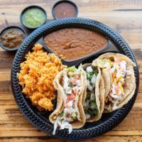 Taco Combo · Combo includes three tacos (your choice, mix or match) cilantro and onion on a corn tortilla...