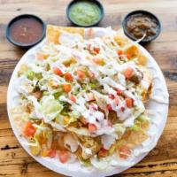 Nachos · Your choice of meat with lettuce, tomato, cheese and sour cream