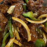 Pepper Steak · Tender slices of beef stir fried with bell pepper an onion in a brown sauce.