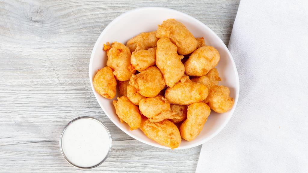Wisconsin Cheese Curds · Honey lager light battered, choice of ranch or chipotle ranch.
