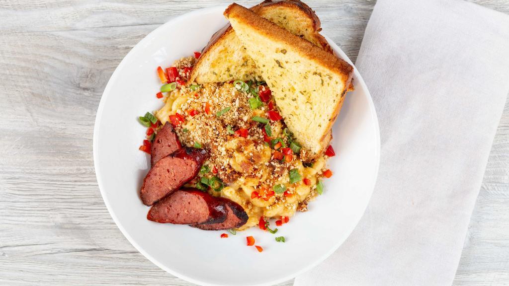 Brew City Mac · WSB amber beer cheese, WI cheddar, mozzarella, usinger smoked sausage, bacon, panko, scallion, red peppers, garlic bread.
