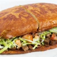 Torta · A Mexican sandwich on Telera bread with your choice of meat, mayo, lettuce, avocado, tomato ...