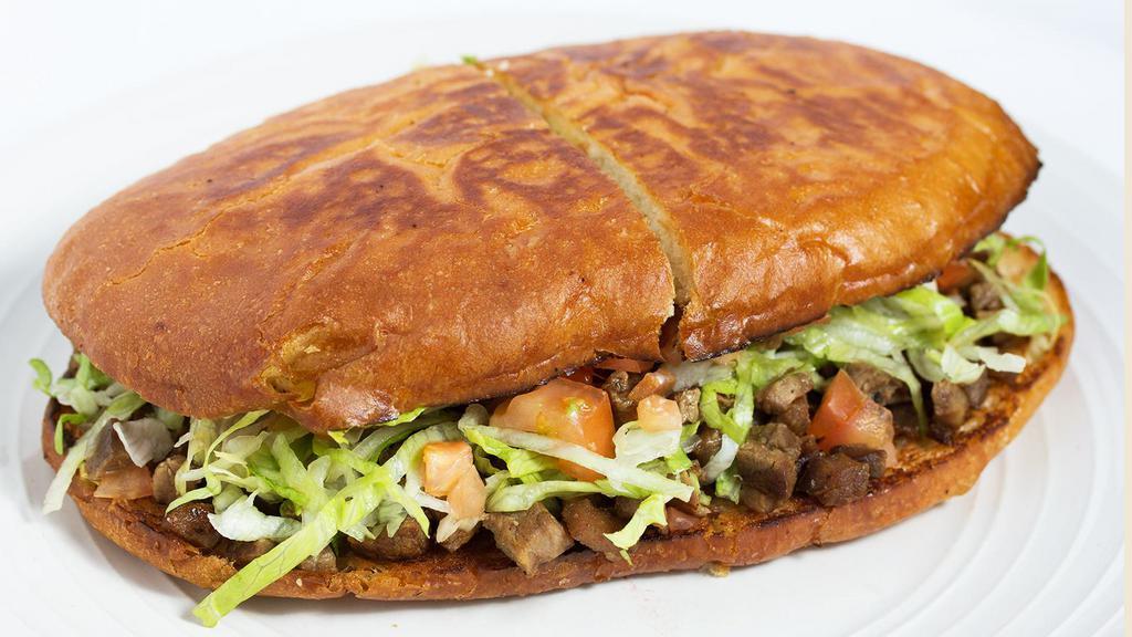 Torta · A Mexican sandwich on Telera bread with your choice of meat, mayo, lettuce, avocado, tomato and pickled jalapeños.