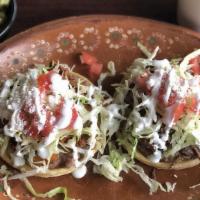 2 Sopes · A thick tortilla topped with your choice of meat, cheese, beans, lettuce, tomato, and sour c...