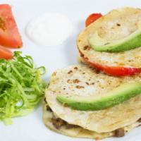 2 Mulitas · A fried tortilla sandwich with cheese, your choice of meat, side of shredded lettuce, sour c...