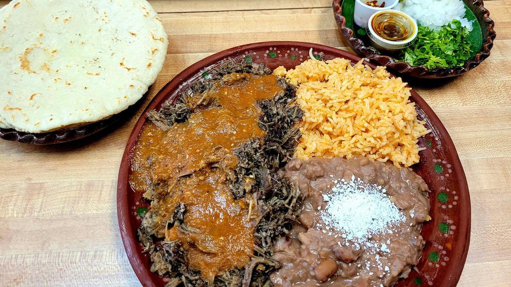 Barbacoa Plate · Beef cheek seasoned with spices, topped with our special salsa served with cilantro, onions, wedge of lime and corn tortillas.