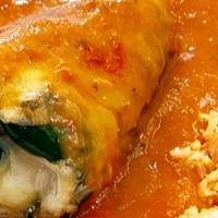 Chile Relleno · Poblano pepper stuffed with queso and coated with egg, served with Rice and Beans with a sid...