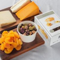 Mongers Cheese & Crackers Bundle · Get a package of three assorted cheeses a box of crackers, dried apricots and assorted olive...