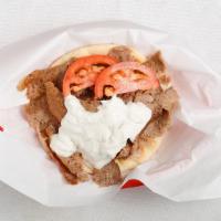 Gyros Sandwich · Delicious seasoned meat served on warm pita bread. Gyros sauce (tzatziki made daily), sliced...