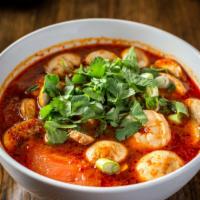 Tom Yum Soup · Hot and spicy. Hot and sour soup with fresh mushrooms, tomatoes, seasoned with lemon grass, ...