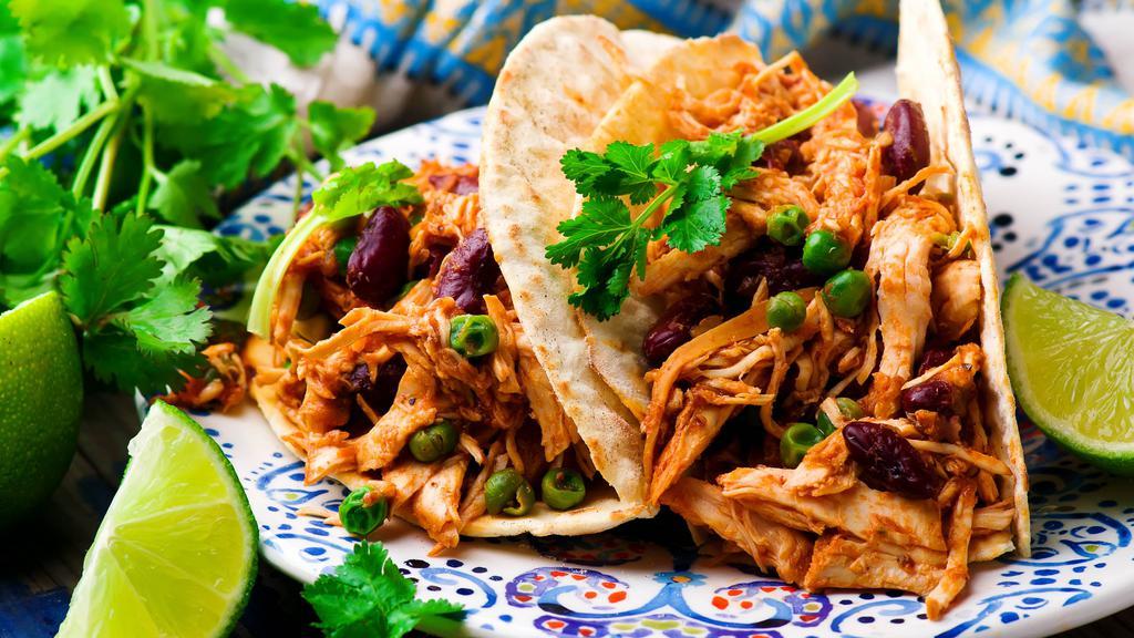 Shredded Chicken Taco · Vietnamese style grilled chicken serve with tortilla and tacos toppings.