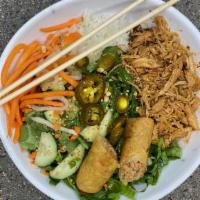 Pulled Chicken Bowl · Vietnamese style pan fried chicken serve with noodles, mixed greens, pickled carrots & daiko...