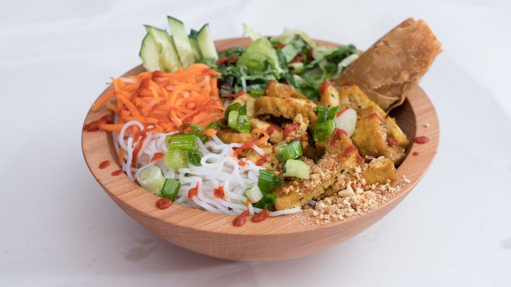 Curry Tofu Bowl · Vietnamese Curried Tofu crispy and juicy vegetarian option serve with noodles, mixed greens, pickled carrots & daikon, cucumber, cilantros, Jalapeños, scallions, and tacos sauce.
