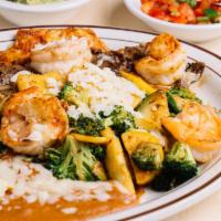 Tres Potrillos Special · Tender rib-eye steak, marinated chicken breast, and jumbo shrimp topped with broccoli, zucch...