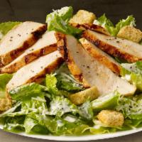 Chicken Caesar Salad · Romaine lettuce tossed in creamy Caesar dressing topped with parmesan cheese and grilled chi...