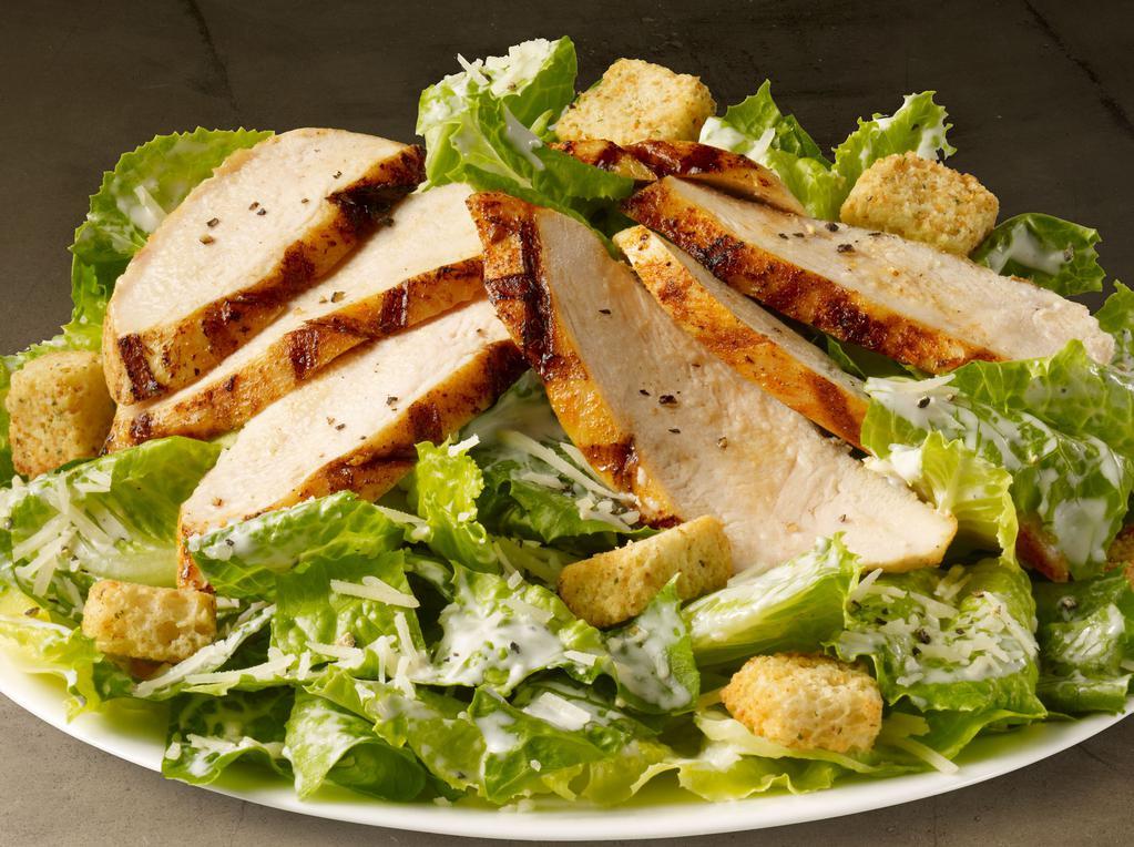 Chicken Caesar Salad · Romaine lettuce tossed in creamy Caesar dressing topped with parmesan cheese and grilled chicken