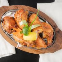 Tandoori Chicken · Whole tender spring chicken marinated in mild spices, fresh herbs, & cooked in the clay oven...