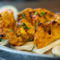 Chicken Tikka · Skinless chunks of chicken breasts marinated in mild seasonings and barbecued on skewers in ...