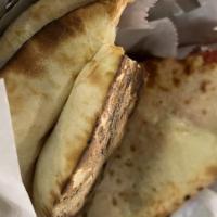 Kashmiri Naan · Leavened bread stuffed with coconut, cherries and dry fruits made with butter and baked in t...
