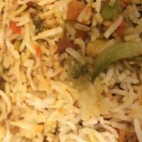 Fried Rice ( V ) · Stir-fried rice with carrots, cabbage, garlic and ginger in light soya sauce. Choice of vegg...