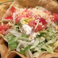 Taco Salad Fajita · Crispy flour tortilla filled with chicken or steak strips. Grilled with onions, bell peppers...