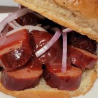 Hot Link · Hot link sandwich served on Kaiser bun with SmokeHouse ICT Signature BBQ sauce.