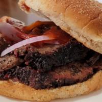 Brisket · Central Texas style brisket smoked low and slow with Oak wood and a simple rub. Served on a ...