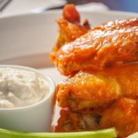Large Jumbo Chicken Wings · 20pc breaded bone-in chicken wings + choice of ranch or bleu cheese dipping sauce + celery s...